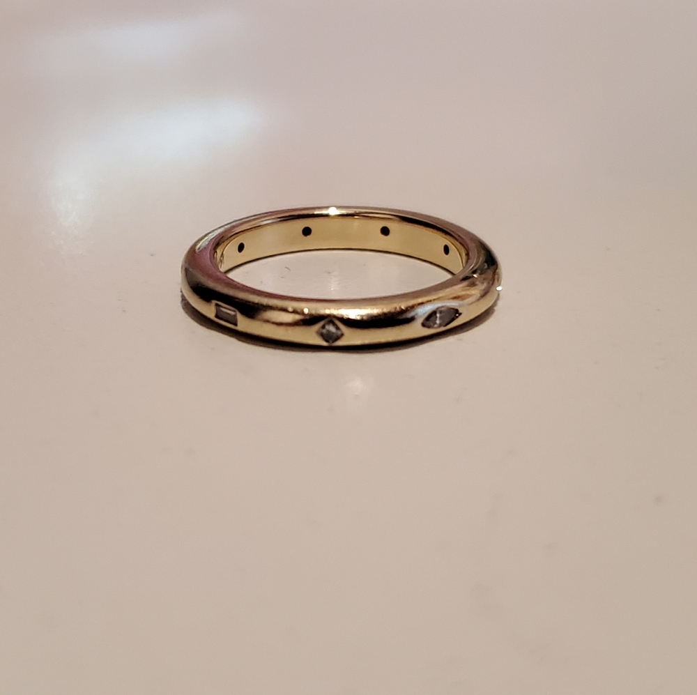 14k yellow gold eternity band with diamonds